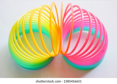 Isolated Colorful And Flexible Bouncy Plastic Spring.