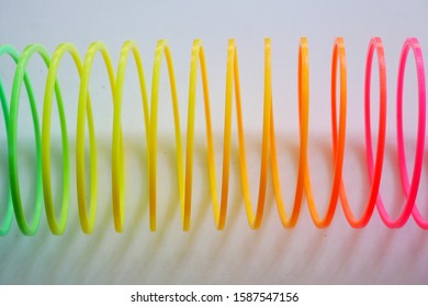 Isolated Colorful And Flexible Bouncy Plastic Spring.