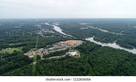 An isolated community with a development section near Catawba river on a sunny day.