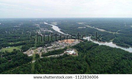 An isolated community with a development section near Catawba river on a sunny day.