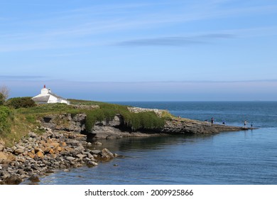 An Isolated Cottage Situated On A Point Near On The Edge Of Moelfre Village, Anglesey, Wales, UK.