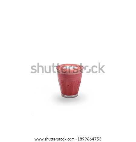 An isolated cup of red velvet latte, with latte art on top serving on latte glass 230ml.