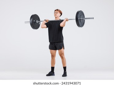 Isolated cutout full body studio shot of strong Asian male fitness athlete sportsman trainer model in casual sport workout outfit lifting barbell training exercising deadlift on white background.