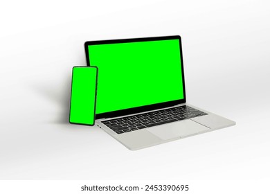 Isolated Devices Mockup. Green screen laptop and green screen mobile phone displayed on white background. Concept of technology and modernity. - Powered by Shutterstock