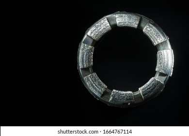 Isolated Diamond Exploration Drill Bit On A Black Background. 