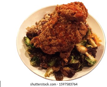 Isolated Dish Of Battered And Deep Fried Chicken On Brussels Sprout Salad