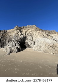 isolated dramatic beach with rock cliffs