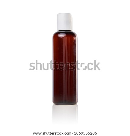 isolated empty plastic dark amber bottle for cosmetics with black lid