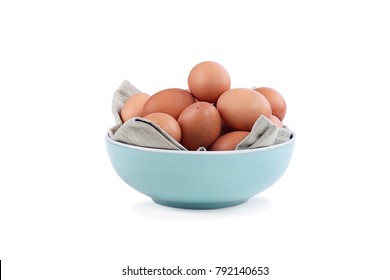 Isolated farm fresh organic brown chicken eggs from free range chickens in a blue bowl over a white background with light shadow. Clipping path included. - Powered by Shutterstock