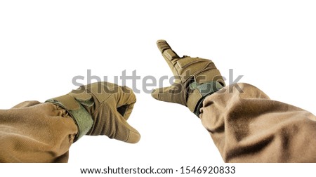 Isolated first person view photo of hand fist and finger pointing in tactical gloves and olive jacket.