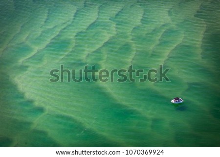 Isolated fishing boat at Lake Macquarie, NSW, Australia