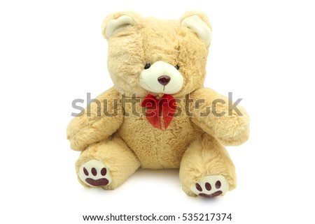 isolated fluffy teddy bear with red ribbon on white background