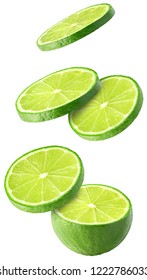 Isolated flying limes. Falling sliced lime fruit isolated on white background with clipping path