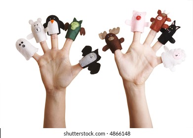 Isolated girl's hands with finger puppet (farm animals, ghost, penguin and dragon)