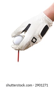 Isolated Glove Hand Setting A Golf Ball