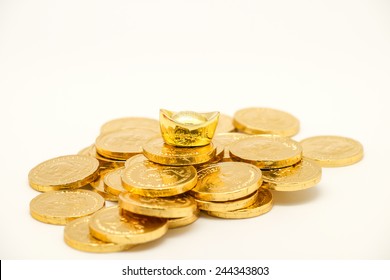 Isolated gold coin and bar, symbol of wealth and prosperity for business or financial background