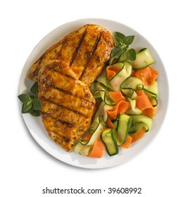 Isolated Grilled Italian Chicken Breast On A Plate With Vegetables