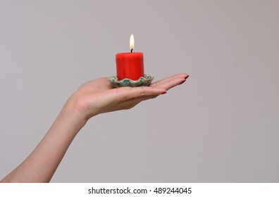  Isolated Hand Holding Candle