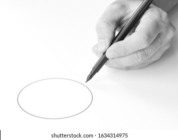 Isolated Hand With A Pen Drawing A Circle