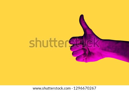 Isolated hand photo on yellow background. Pink hand collage style. Bright pop art template with space for text. Creative minimalistic backdrop. Poster, banner idea. Gestures with fingers