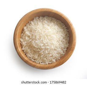 Isolated Handful Of Raw Rice In The Wood Bowl