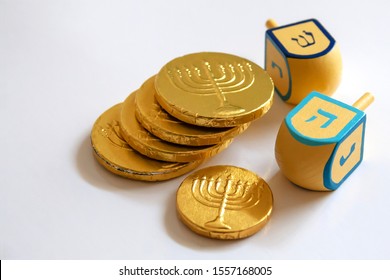 Isolated Hanukkah Dreidel With Chocolate Coins