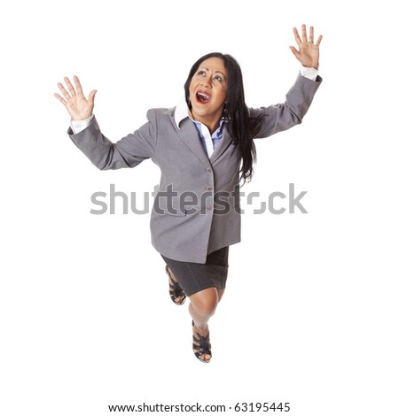 Isolated high angle full length studio shot of a Latina businesswoman looking up in fear with arms raised as if fleeing from a perilous situation.