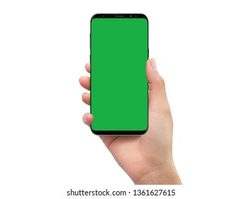 Isolated Human Right Hand Holding Black Mobile Smart Phone With Green Screen For Video Production