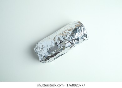 Isolated Image Burrito Wrap In Aluminium Foil.