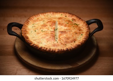 Isolated Image Of Chicken Pot Pie On Table