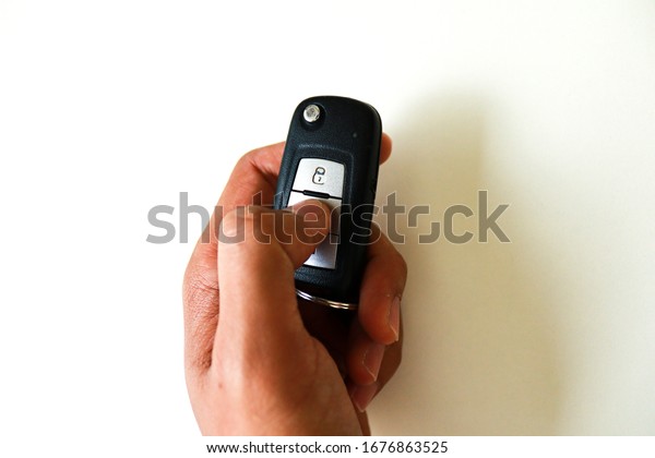 Isolated image of hand
holding car key.