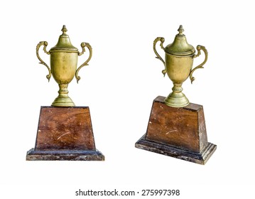 Isolated Image Of An Od Trophy Made From Brass Which Have Wood As Base