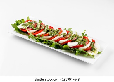 Isolated Italian Caprese Salad With Mozzarella And Tomatoes On The White Background