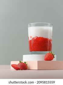 Isolated korean ice strawberry milk with raw strawberry in bright photography. Korean strawberry milk made from strawberry compote and fresh milk.