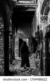 Isolated Lady Standing Inside A Haunted Old Abandoned House.Monochrome Shot