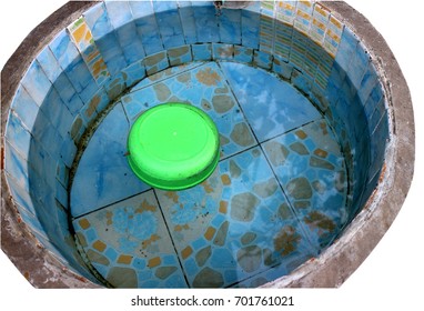 Isolated Large Tile Bowl With Water And Green Plastic Small Bowl Floating Upside Down