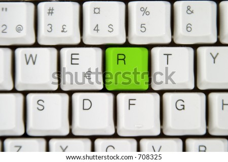 Isolated letter R on from a computer desktop keyboard highlighted in green
