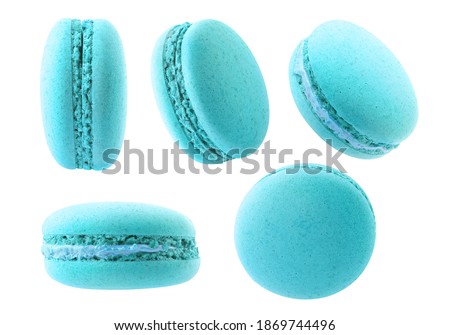 Isolated light blue macarons. Collection of blueberry or bubblegum macaroons at different angles isolated on white background