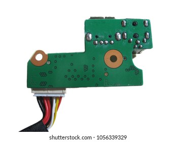 Isolated macro of a green computer circuit board with wiring harness