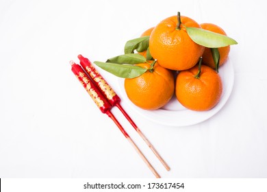 Isolated Mandarin Orange And Ancient Chinese Candle Wax Stick