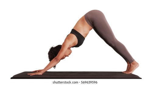Isolated mixed race millennial woman doing yoga on matt