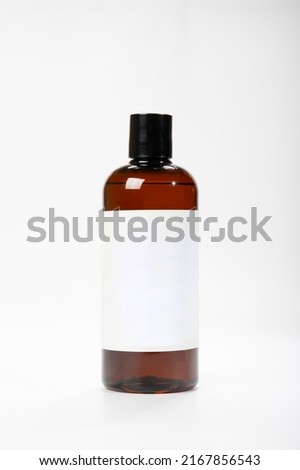 The isolated mock-up medicine or shampoo bottle on white background