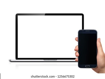 Isolated Mockup Of Mobile Phone And Computer. Hand Holding A Samsung Cellphone In Front Of A Macbook.  