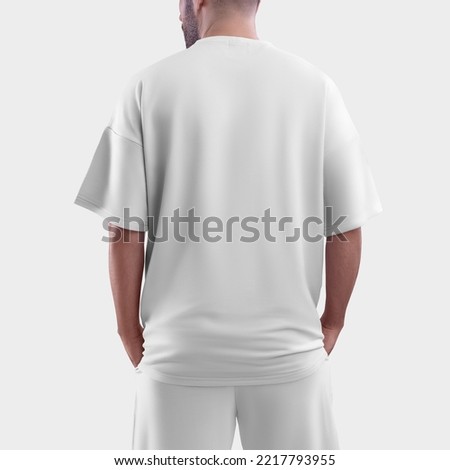 Isolated mockup of oversized men's t-shirt for design, print, pattern. Template of fashionable clothes. Back view