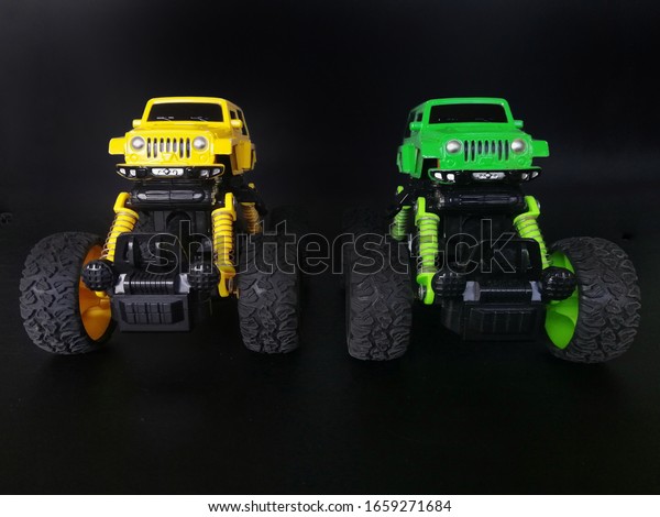 isolated\
monster trucks toy with black background\
