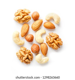 Isolated Nuts Pattern Background. Walnut, Cashew, Almond And Hazelnut On White Background. View From Above. Macro