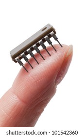 An Isolated On Hand On A White Background Holding A Micro Chip On The Finger Tip