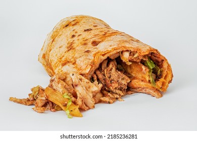 Isolated on a white background, spoiled and greasy and unhealthy doner or shawarma. Harmful and dangerous fast and street food - Powered by Shutterstock