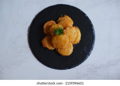 Isolated On White Of A Plate Of Fried Potato Cake Or Perkedel Kentang