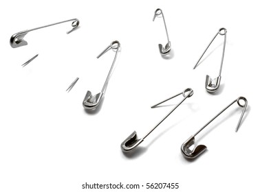 Isolated, Open Safety Pin In White Background